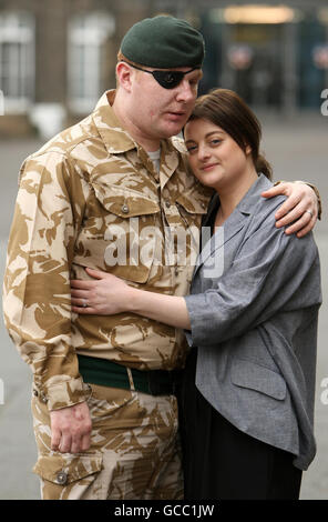 Rifleman Paul Jacobs, of The Rifles, who was awarded a George Medal in the Operational Awards List, and his fiancee Louise Smith, 24, at a ceremony at the Honourable Artillery Company, in central London. Stock Photo