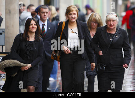 Family members of Corporal Jonathan Horne, including his widow Rachel Horne (centre) arrive at Wiltshire Coroner's Court, sitting at Trowbridge Town Hall, to hear the inquest into his death and that of four other soldiers killed in Afghanistan on July 10, 2009. Stock Photo