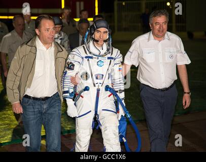 Director General of Roscosmos Igor Komarov, left, and First Deputy Director General Alexander Ivanov walk with Russian cosmonaut Anatoly Ivanishin to the launch pad in preparation for launch July 7, 2016 at the Baikonur Cosmodrome in Kazakhstan. Ivanishin joins crew members American astronaut Kate Rubins and Japanese astronaut Takuya Onishi on four-month mission. Stock Photo