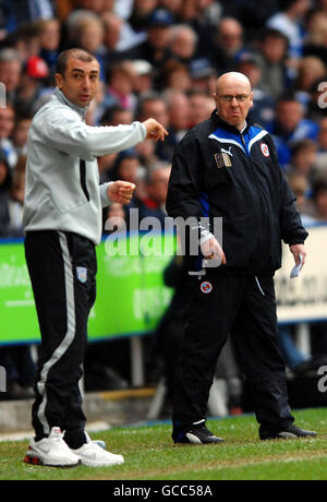 West Bromwich Albion manager Roberto Di Matteo and Reading manager Brian McDermott (right) on the touchline during the Coca-Cola Championship match at the Madejski Stadium, Reading. Stock Photo