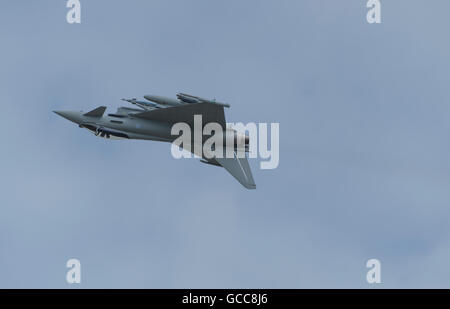 RAF Fairford, Gloucestershire. 8th July, 2016. Day 1 of the Royal International Air Tattoo (RIAT) with international military aircraft on display from around the world. RAF Eurofighter Typhoon inverted flypast. Credit:  aviationimages/Alamy Live News. Stock Photo
