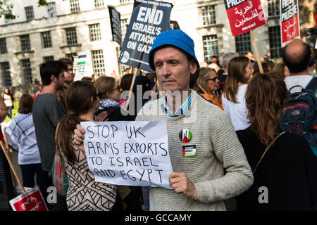 London, UK. 8th July 2016. A crowd of demonstrators gathered opposite Downing Street at 'End The Siege On Gaza' rally to demand an end the arms trade between the UK and Israel as well as to call for an end to Israel's ten year occupation of Gaza. Wiktor Szymanowicz/Alamy Live News Stock Photo