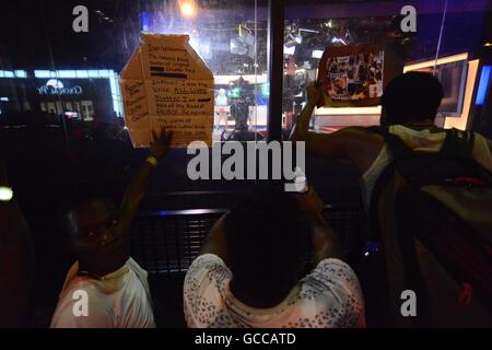 Philadelphia, Pennsylvania, USA. 8th July, 2016. From outside the studio on Market Street, in Philadelphia, Pennsylvania, protesters from a July 9th, 2016 Black Lives Matter march try to distract WTXF-TV anchors during a live broadcast. Credit:  Bastiaan Slabbers/ZUMA Wire/Alamy Live News Stock Photo
