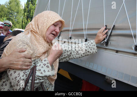 Visoko, Bosnia and Herzegovina. 9th July, 2016. ADILA SULJIC is seen crying next to the truck in which are 127 coffins of newly identified victims of Srebrenica massacre . In one of the coffins there is one bone of her husband who was killed in the massacre in Srebrenica. Credit:  Armin Durgut/ZUMA Wire/Alamy Live News Stock Photo