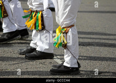 Ewell, Epsom, Surrey, England, UK. 9th July 2016. The Spring Grove Kingston Morris Men performing at the Ewell Village Fair, Surrey, on the Time Well Spent Day of Dance. They were joined by dance sides from Carshalton and Ewell St Mary’s Morris Men to make one of the largest displays of Morris Men. They started at the Green Man pub for 30 minutes of dancing before parading along the High Street to the Lock Up for a drinking challenge, then off for more dancing. Credit:  Julia Gavin UK/Alamy Live News Stock Photo