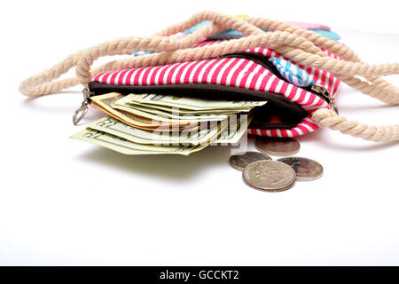 Money coming out of girl hand bag close up. Stock Photo