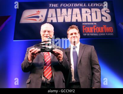 Southampton supporter Herbert Taylor (left) recieves the EA Sports fan of the year award from EA Sports Marketing Director Trevor Uzice (right) during the 2010 Football League Awards at the Grosvenor House Hotel, Park Lane, London Stock Photo