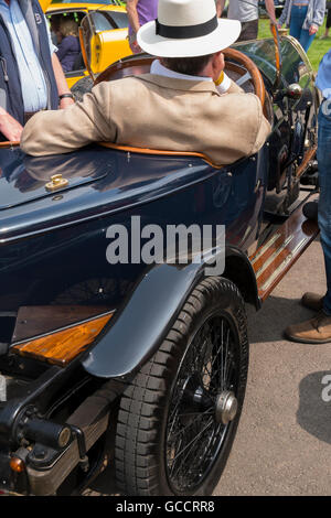Men sitting in their 1930s Bugatti at the French and Italian motoring festival at Prescott Hill Climb,Gloucestershire, UK Stock Photo