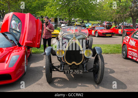 Men sitting in their 1930s Bugatti at the French and Italian motoring festival at Prescott Hill Climb,Gloucestershire, UK Stock Photo