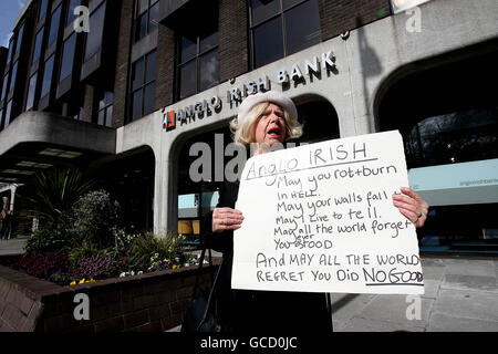 Theresa Kavanagh protests outside Anglo Irish Bank on St.Stephen's Green Dublin today as the bank announced the biggest corporate losses in Irish history - 12.7 billion euro (&pound;11.3 billion). Stock Photo