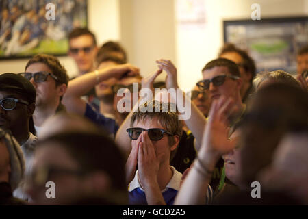 Chelsea fans, wearing 3D glasses at Riley's pub in Kings Road, London, as they join football fans across the country to watch the top of the table clash between Manchester United and Chelsea on Sky 3D, Europe's first 3D TV channel that launched today. Stock Photo