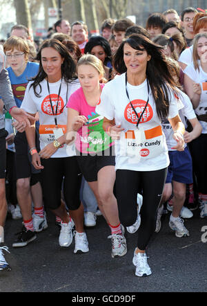 Tamara Ecclestone and Lizzie Cundy taking part in Sainsbury's Sport Relief Mile, on London's Southbank. The charity is charity is raising funds for the poor in the UK and abroad. Stock Photo