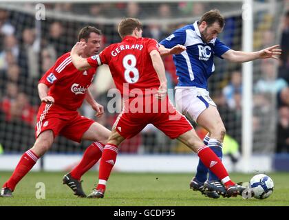 Soccer - Barclays Premier League - Birmingham City v Liverpool - St Andrew's Stadium. Liverpool's Jamie Carragher (left) and Steven Gerrard (centre) close in on Birmingham City's James McFadden (right) for the ball Stock Photo