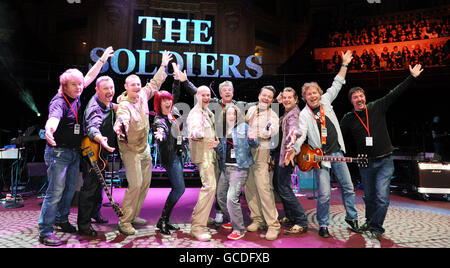 Lance Corporal Ryan Idzi (3rd left), Sergeant Major Gary Chilton (5th left) and Sergeant Richie Maddocks (4th right) at rehearsals with their band at the Royal Albert Hall during their Coming Home Tour. The Soldiers reached number four in the UK album chart with their debut release Coming Home, in October last year, selling 600,000 copies and are joined by the two US soldiers. Scarlett from Atlanta and Basnight from Georgia, both sergeants in the US Army, asked to sing alongside The Soldiers in a 'personal show of solidarity' for fellow soldiers worldwide. PRESS ASSOCIATION Photo. Picture Stock Photo