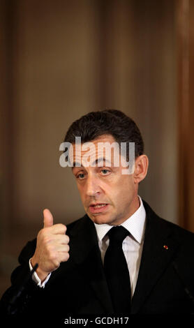 French President Nicolas Sarkozy gestures as he takes part in a meeting ...