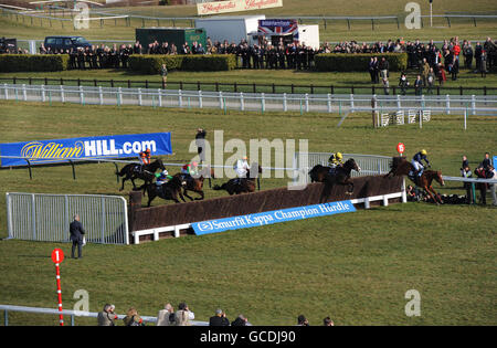 Chief Dan George ridden by Paddy Aspell (second right) jumps the last fence and goes on to win the William Hill Trophy Handicap Chase during day one of the 2010 Cheltenham Festival at Cheltenham Racecourse. Stock Photo