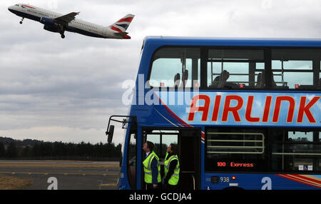 A British Airways plane takes off at the launch of Lothian Buses' new fleet of 14 new Airlink buses costing 3million pounds, the buses will transport passengers from Edinburgh airport to the city centre, when they go into operation on the March 28. Stock Photo