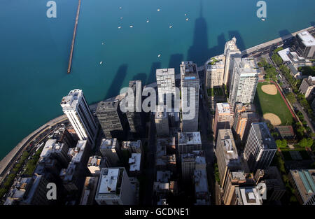 Shadows from skyscrapers in Chicago including the John Hancock Center are cast over Lake Shore Drive as seen from 360 Chicago Stock Photo