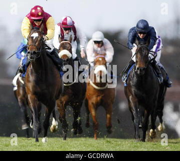 Noll Wallop ridden by Wayne Lordon (left) wins the Leopardstown 2,000 Guineas Trial Stakes during the 1000 and 2000 Guineas Trials Day at Leopardstown Racecourse. Stock Photo