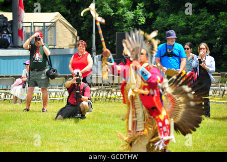 Native Canadians hold a Pow Wow at a Canada Day celebration held in the Canadian city of London, Ontario. Stock Photo