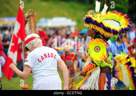 Native Canadians hold a Pow Wow at a Canada Day celebration held in the Canadian city of London, Ontario. Stock Photo