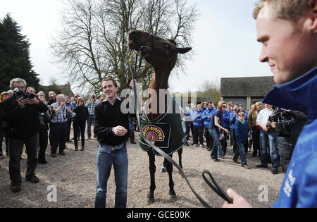 Horse Racing - 2010 John Smith's Grand National - Dont Push It Parade - The Plough Inn at Ford. Jockey Tony McCoy with Don't Push It as groom Alan Berry (right) looks on during the parade at The Plough Inn at Ford, Temple Guiting. Stock Photo