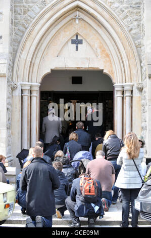 The congregation spills out on to the pavement outside St Andrew Bobola's RC Polish Church, during a mass for Parish Priest Monsignor Bronislav Gostomski, who dies in the Polish plane crash. Stock Photo