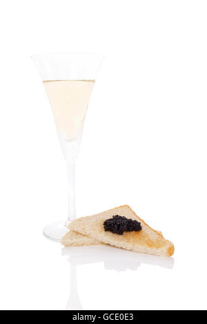Delicious black caviar on toast bread and champagne isolated on white background. Exquisite luxurious gourmet eating. Stock Photo