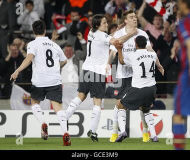 Soccer - UEFA Champions League - Quarter Final - Second Leg - Barcelona v Arsenal - Nou Camp. Arsenal's Nicklas Bendtner (2nd right) is congratulated by his team mates after scoring the opening goal of the game