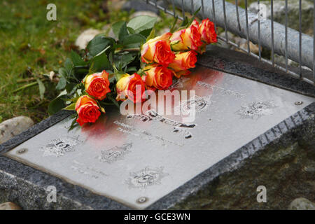 Flowers left outside the headquarters of Hampshire Fire and Rescue Service after the deaths of fire fighters Alan Bannon and James Shears, who died during a fire at Shirley Towers in the Shirley area of Southampton overnight. Stock Photo