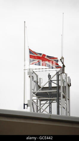 The Union flag flies at half-mast above the fire station in St Marys in Southampton after fire fighters Alan Bannon and James Shears based at the station were killed during a fire at Shirley Towers in the Shirley area of the city overnight. Stock Photo