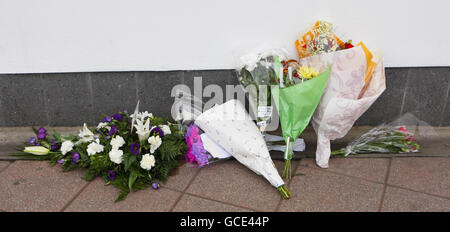 Flowers outside the fire station in St Marys in Southampton after fire fighters Alan Bannon and James Shears based at the station were killed during a fire at Shirley Towers in the Shirley area of the city overnight. Stock Photo