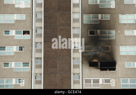A resident of Shirley Towers in Southampton looks across at the charred building after fire fighters Alan Bannon and James Shears were killed during a fire there overnight. Stock Photo