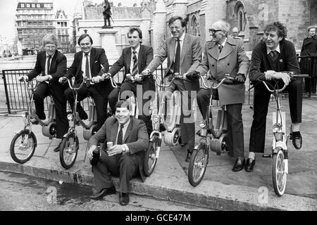 Kerbside champagne for bike inventor Phil Campopiano outside the Palace of Westminster, London, with MPs (L to R) Alfred Dubs (Battersea); John Prescott (Kingston-upon-Hull); Simon Hughes (Southwark and Bermondsey); Ian Twinn (Edmonton); Frank Haynes (Ashfield) and winner, Austin Mitchell (Great Grimsby) after they test drove and raced the new electric power assisted bike, the 'Pedelec Stella', which will be trade launched tomorrow. Stock Photo