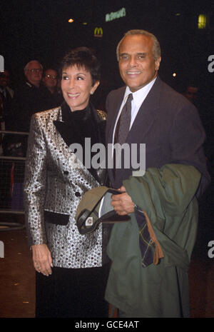 Harry Belafonte and his wife Julie Robinson arrive for the premiere of his new film 'Kansas City'. Stock Photo