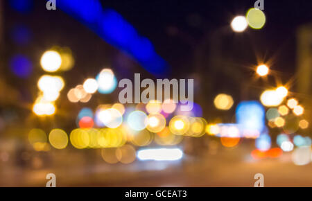 abstract background of blurred street warm city lights with cool blue and purple background with bokeh effect Stock Photo