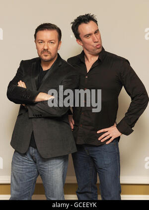 Ricky Gervais and Christian O'Connell present Simon Cowell, from Wildlife Aid, with a cheque after Ricky won the most votes on the 'Who's calling Christian?' slot on Absolute radio. Stock Photo