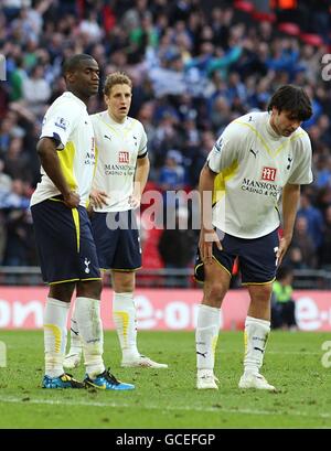 Soccer - FA Cup - Semi Final - Tottenham Hotspur v Portsmouth - Wembley Stadium. Tottenham Hotspur's Sebastien Bassong (left), Michael Dawson (centre) and Vedran Corluka (right) stand dejected after the final whistle. Stock Photo