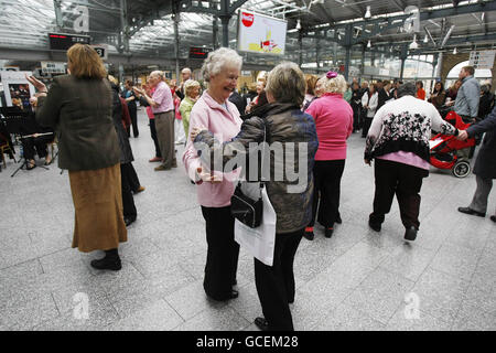 Members of the Public Waltz to the sounds of 'Blow the Dust off your trumpet Orchestra' at Heuston Station in Dublin at the launch of the Bealtaine Festival, a unique national festival celebrating creativity in older age running from May 1st - 31st. Stock Photo