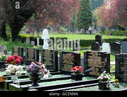 A man walks through Arnos Vale a Victorian garden cemetery in Bristol. Stock Photo