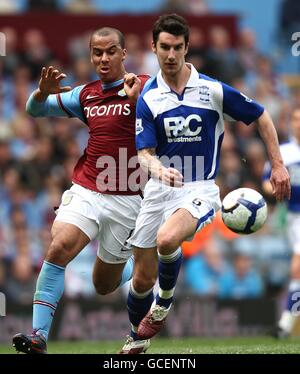 Aston Villa's Gabriel Agbonlahor (left) and Birmingham City's Liam Ridgewell (right) in action Stock Photo