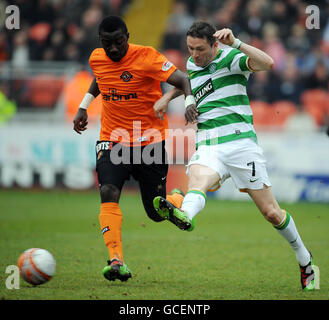 Celtic's Robbie Keane and Dundee United's Prince Bauben battle for the ball during the Clydesdale Bank Scottish Premier League match at Tannadice Park, Dundee. Stock Photo