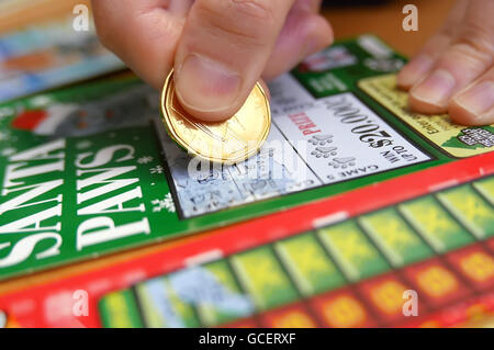 Coquitlam BC Canada - January 24, 2015 : Woman scratching lottery tickets. The British Columbia Lottery Corporation has provided Stock Photo