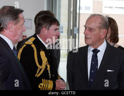 The Duke of Edinburgh (right) meets delegates as he and Britain's Queen Elizabeth II officially open one of the UK's top military buildings - Permanent Joint Headquarters - in Northwood, West London. Stock Photo