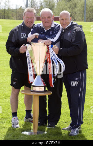 SPECIAL PICTURE - RELEASED EXCLUSIVELY THROUGH THE PRESS ASSOCIATION FOR USE BY NATIONAL AND REGIONAL NEWSPAPERS - UK & IRELAND ONLY. NO SALES. Rangers' Ally McCoist (left) Walter Smith and Kenny McDowall (right) with the SPL trophy. Picture date: Friday May 7, 2010. Photo credit should read: Kirk O'Rourke/Rangers FC/PA. FOR MORE RANGERS PICTURES OR LICENSING OF THESE IMAGES FOR OTHER USE - PLEASE CONTACT EMPICS - 0115 844 7447 OR info@empics.com Stock Photo