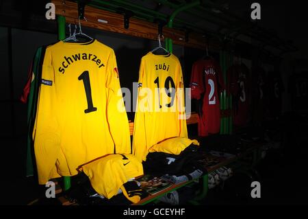 Fulham players shirts hang in the dressing room prior to kick off Stock Photo