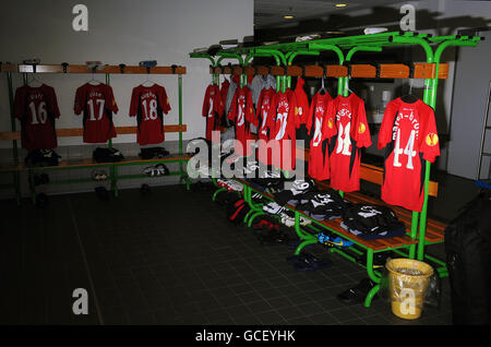 Fulham players shirts hang in the dressing room prior to kick off Stock Photo