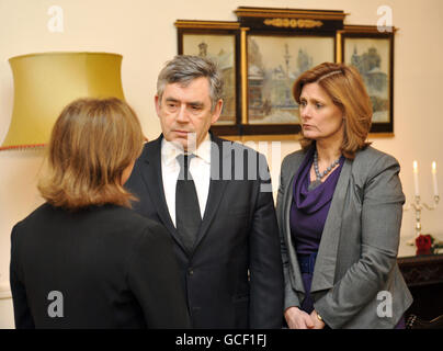 Prime Minister Gordon Brown and his wife Sarah speak with Barbara Tuge-Erecinska (left), the Polish ambassador to the UK, after adding their names to the book of condolence at the Polish embassy in Portland Place, London, after Poland's president Lech Kaczynski was among the 96 who died when a plane carrying them to Russia crashed on Saturday. Stock Photo