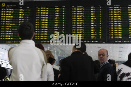 Passengers look for information on cancelled flights at Dublin Airport as all non-emergency flights were grounded due to ash from Iceland's volcanic eruption. Stock Photo