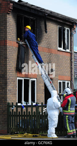 Emergency services attend the scene of a house fire in Buxton, Derbyshire, in which two young children died. Stock Photo